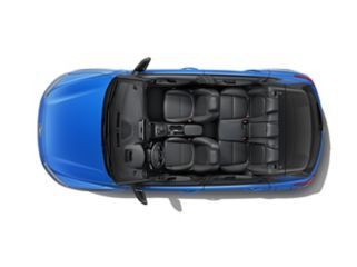 An aerial view of a blue car with black seats on a white background.