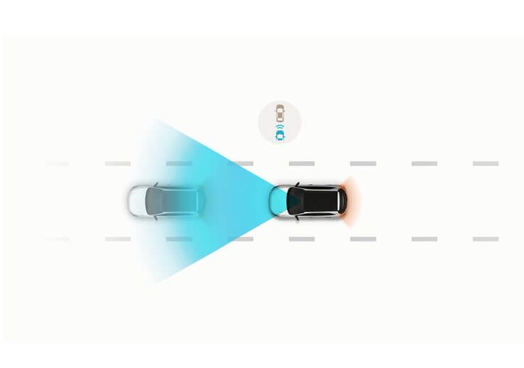 A car is driving down a road next to another car.