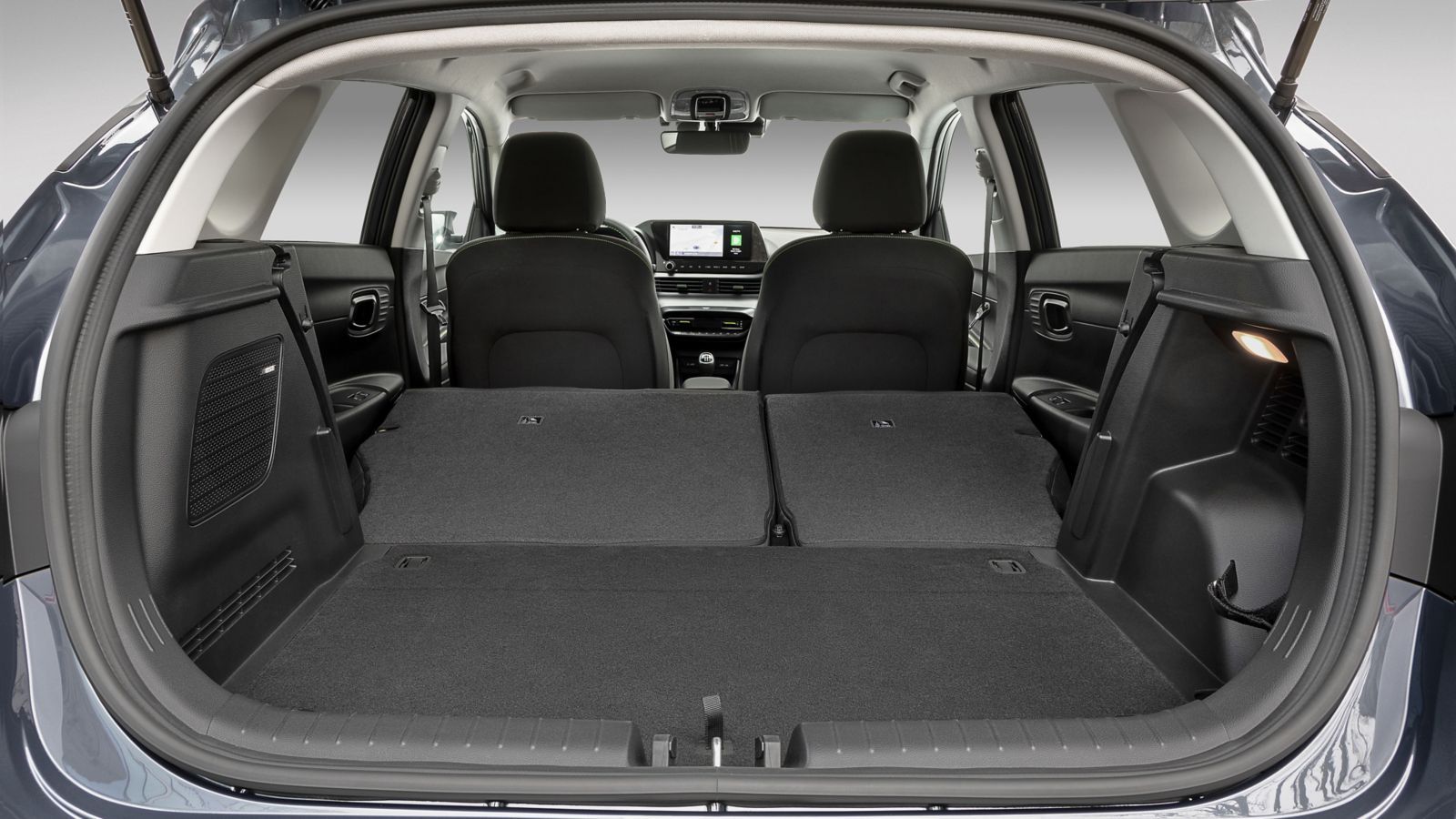 The trunk of a car with the seats folded down
