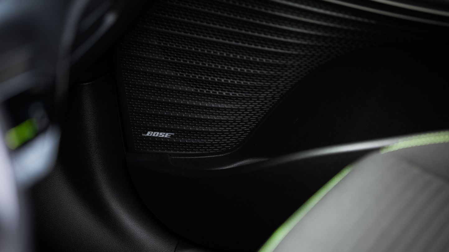 A close up of a bose speaker in a car.