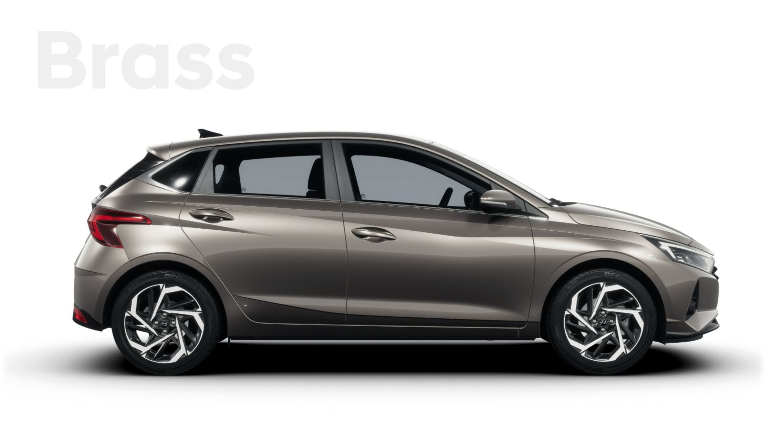 A hyundai i20 hatchback in brass is shown on a white background.