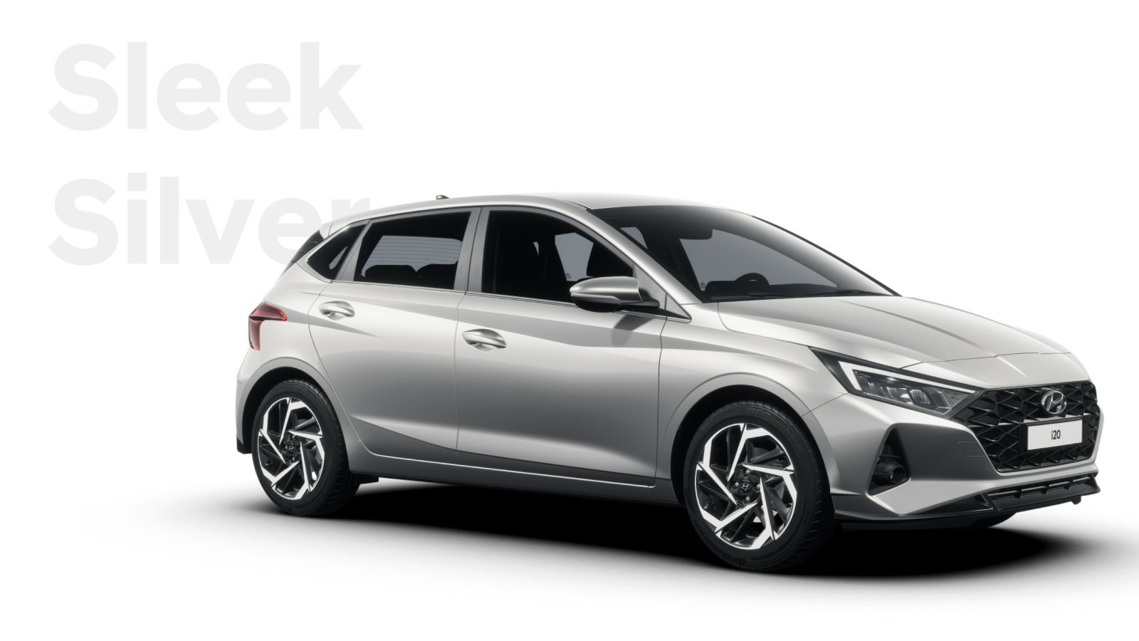 A silver hyundai i20 hatchback is shown on a white background.