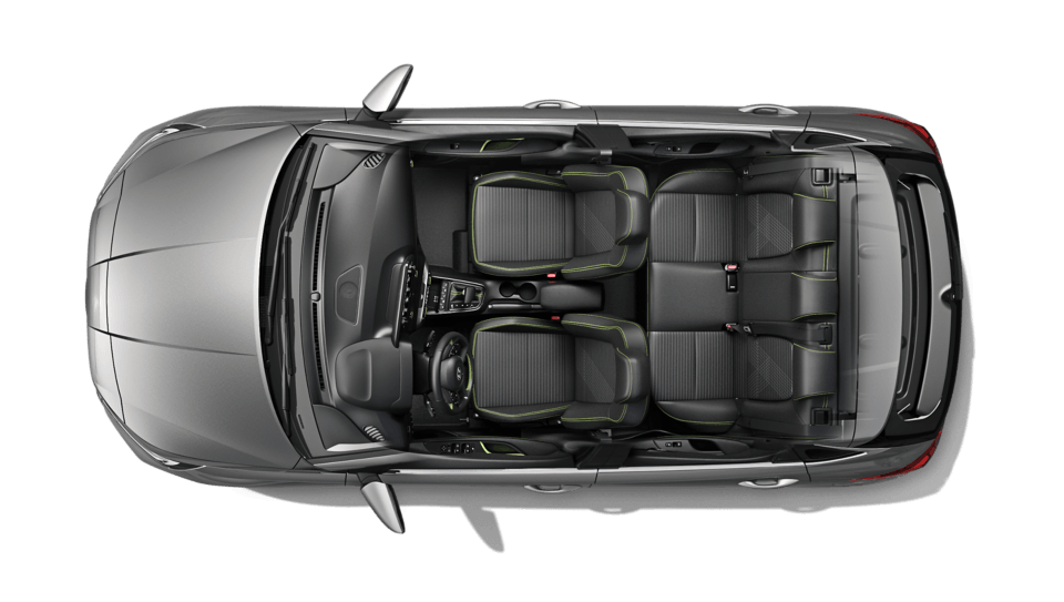 An aerial view of a gray car with black seats on a white background.