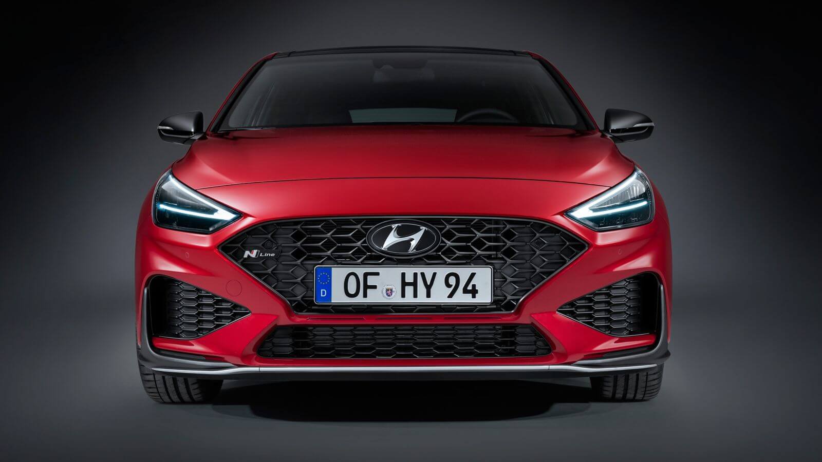 The front of a red hyundai i30 n line is shown.