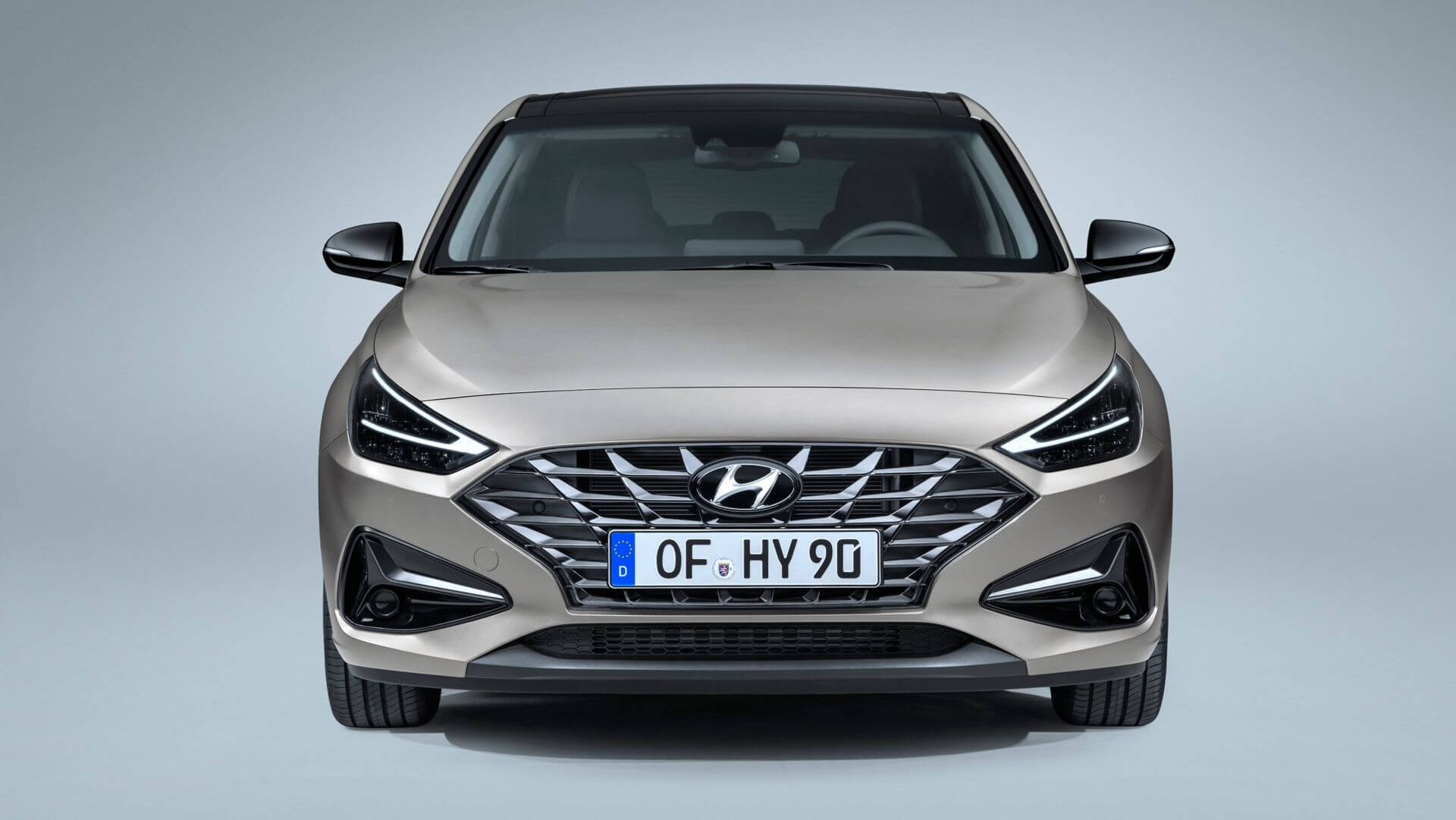 The front of a hyundai i30 is shown on a gray background.