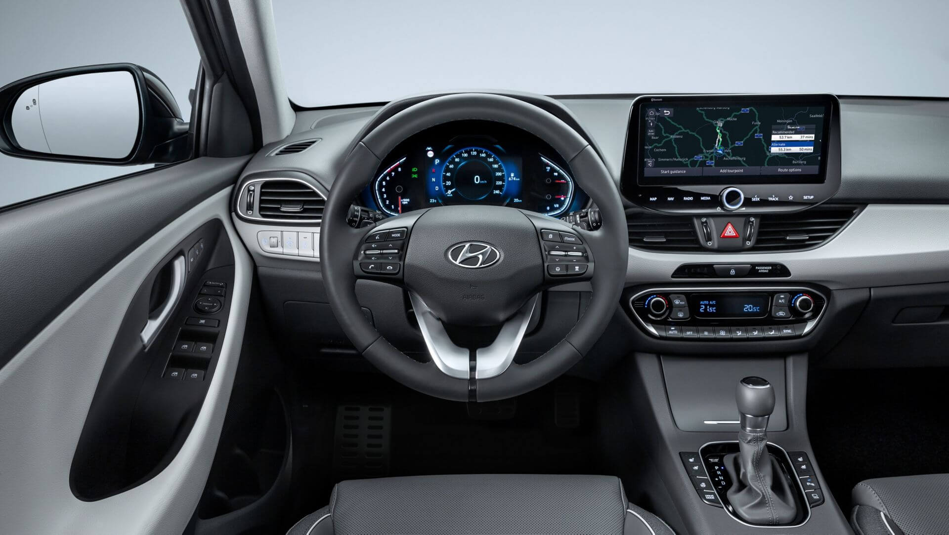 The interior of a car with a steering wheel and dashboard.