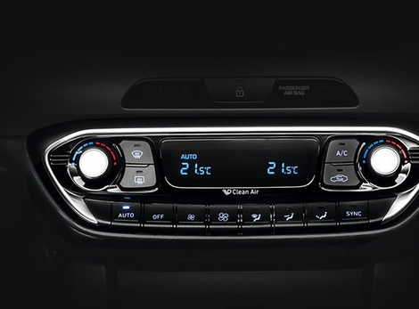 A close up of a car 's a/c control panel.