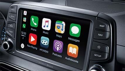 A car radio with a lot of apps on it.