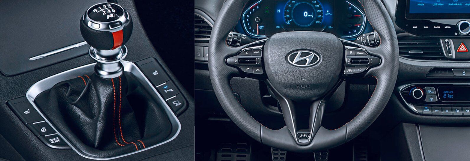 A close up of a steering wheel and a shifter in a car.