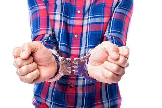 Bail Bondsman — Man in Handcuffs in Salisbury, NC Bail Bondsman — Man in Handcuffs in Salisbury, NC