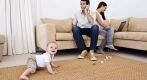 A baby playing on a carpet