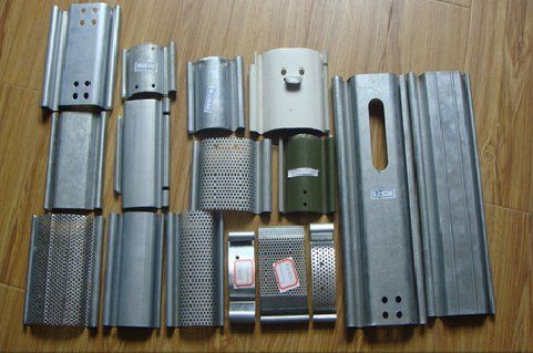 A selection of shutter door sections showing end holes and viewing slots which can be punched during manufacturing.