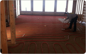 Man laying infloor heating lines Man laying infloor heating lines