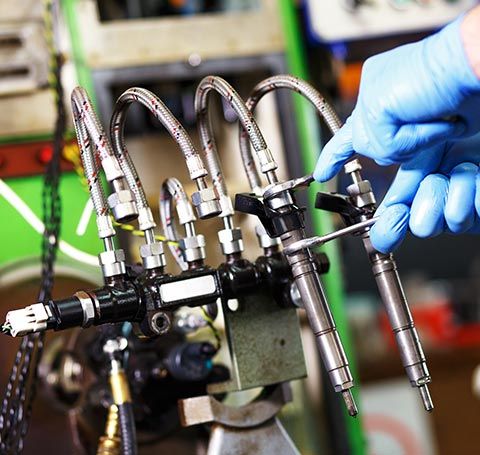 Mechanic Testing the Diesel Injector | Callahan, FL | Diesel PowerHouse Mechanic Testing the Diesel Injector | Callahan, FL | Diesel PowerHouse