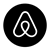 The airbnb logo is in a black circle on a white background.