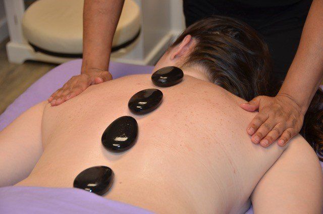 Stone Massage — Cumberland County, ME — Beauty Barn and Wellness
