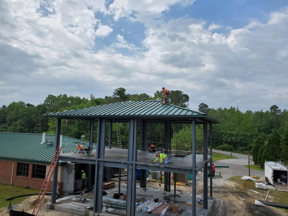 Construction Workers Working On Roof 
