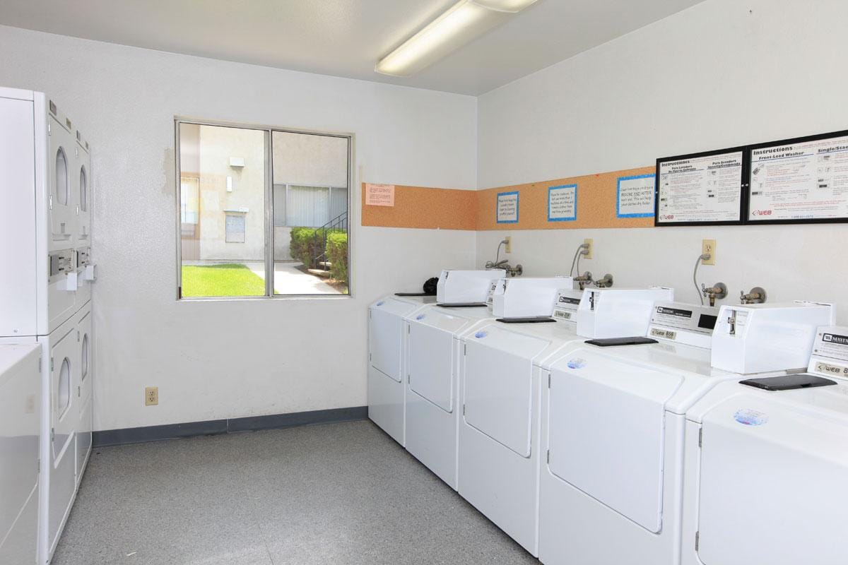 Parkwood Village laundry room; multiple washers and dryers.