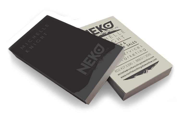 Two business cards, black and tan, with