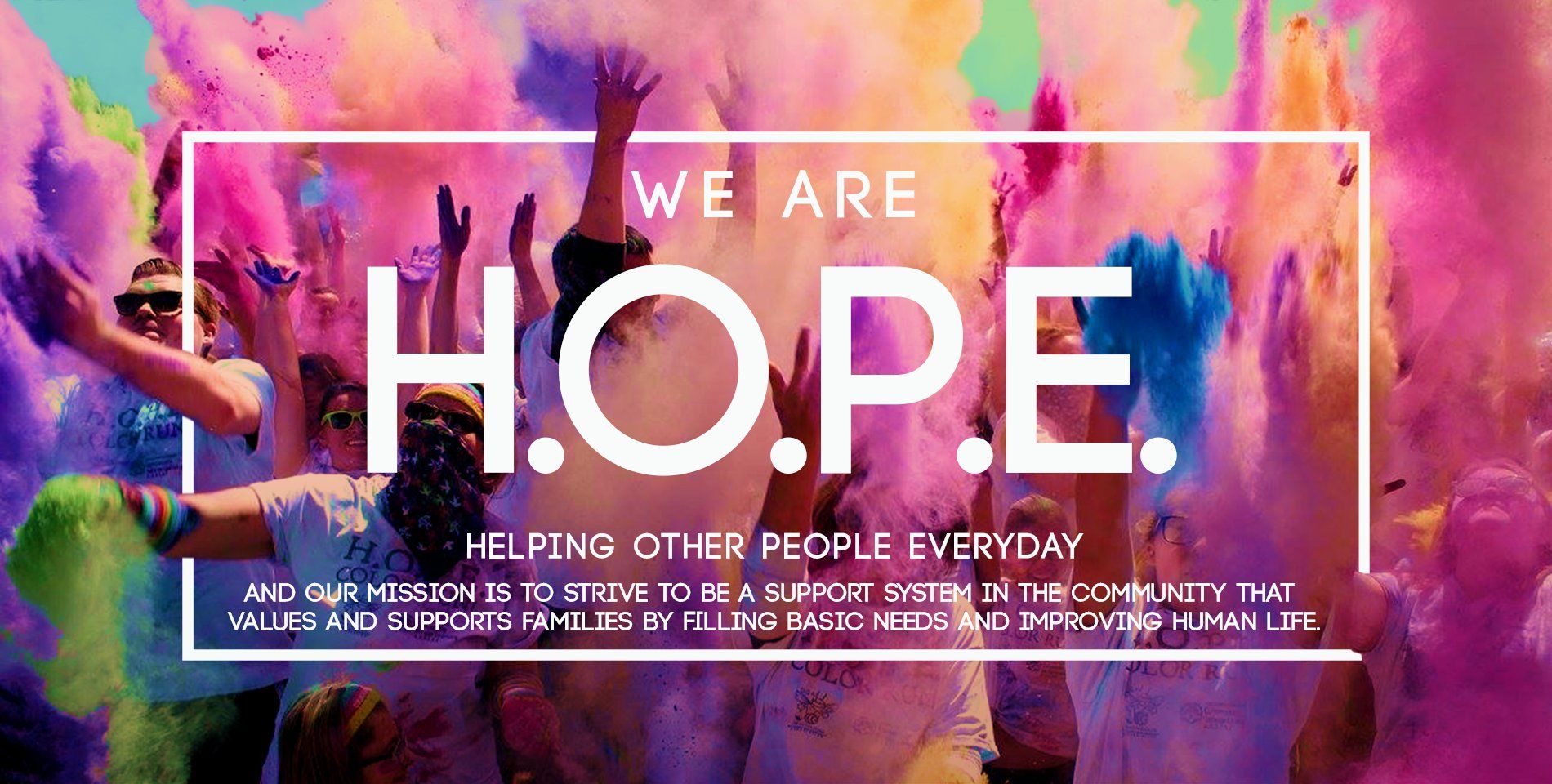 People covered in colorful powder celebrate, with text 