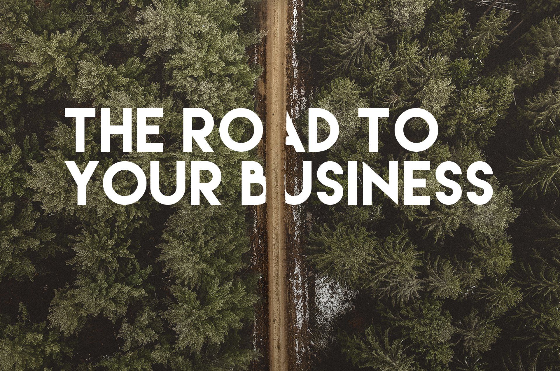 A winding road through a dense forest with the text 