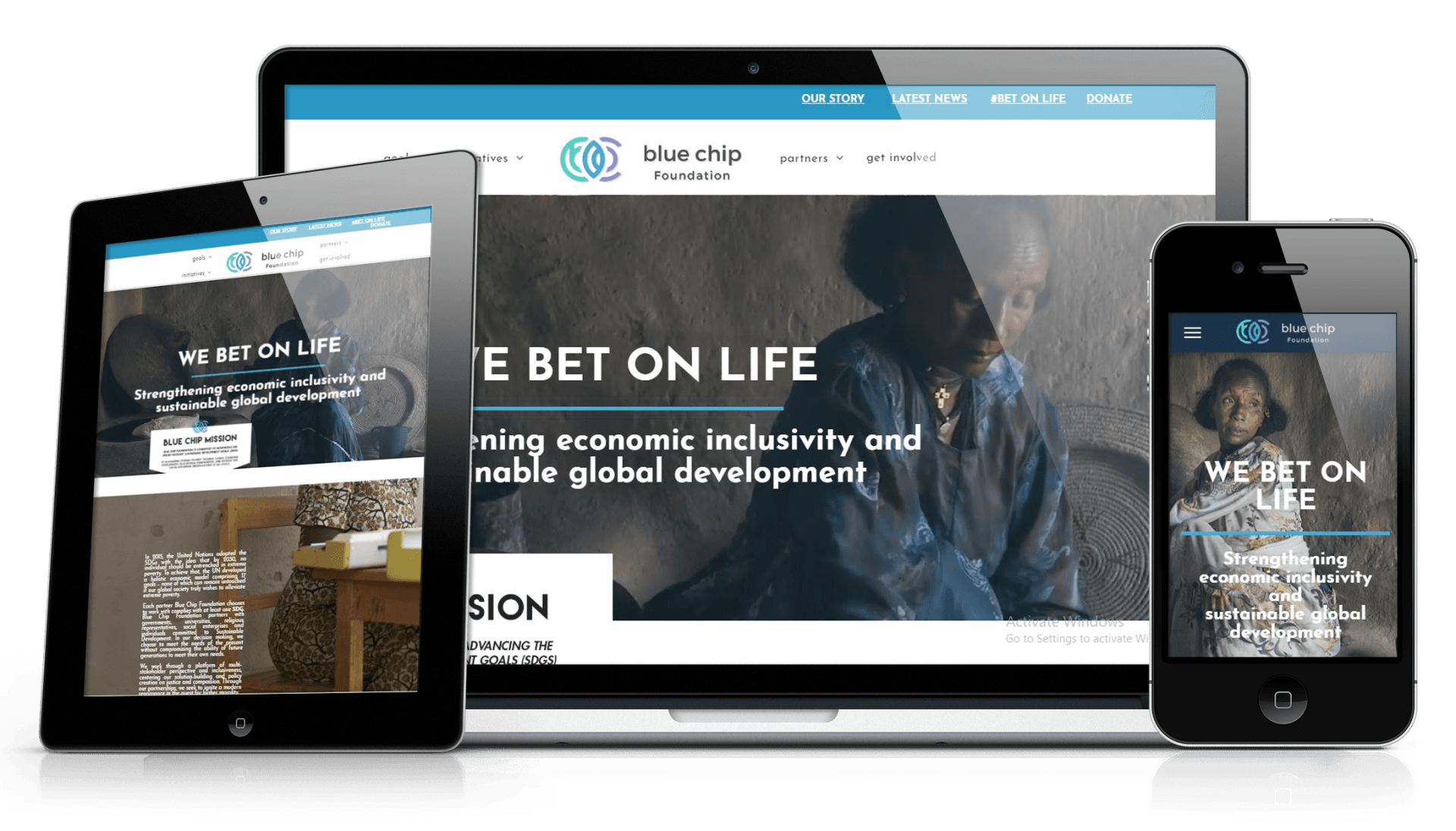 Responsive website design displayed on a laptop, tablet, and smartphone screen.
