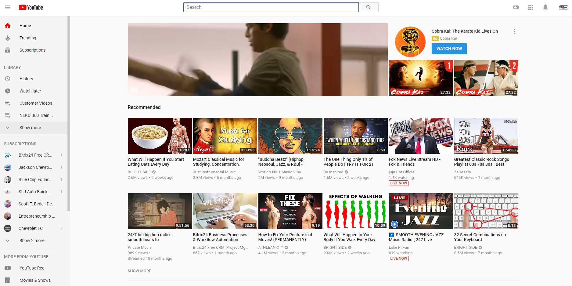 YouTube homepage displaying a profile icon, video thumbnails, and a search bar.