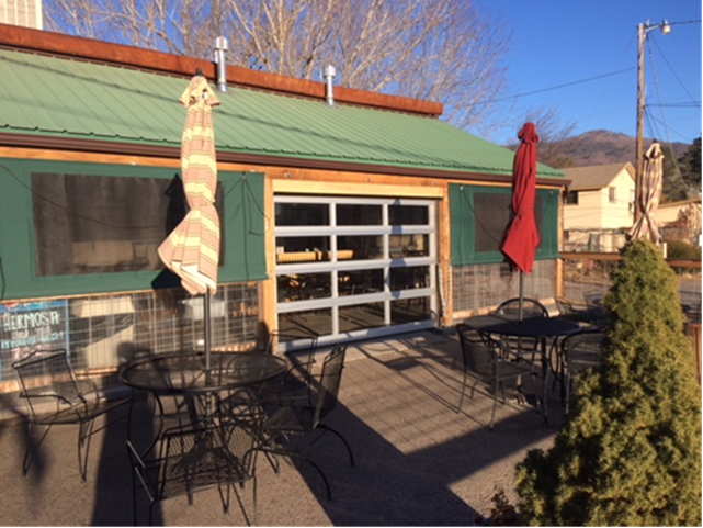 Garage Door Repair — Green Store With Customized Garage Door in Durango, CO