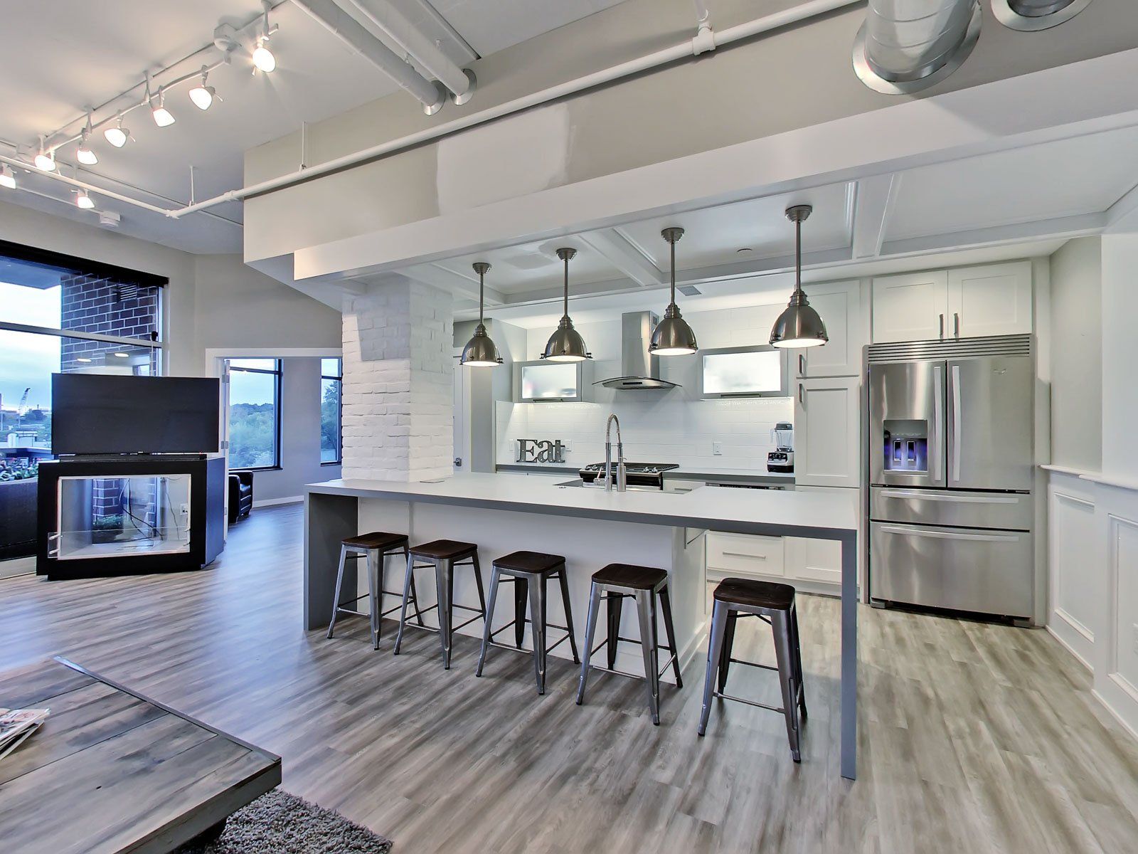 Northside lofts kitchen with bar and bar stools