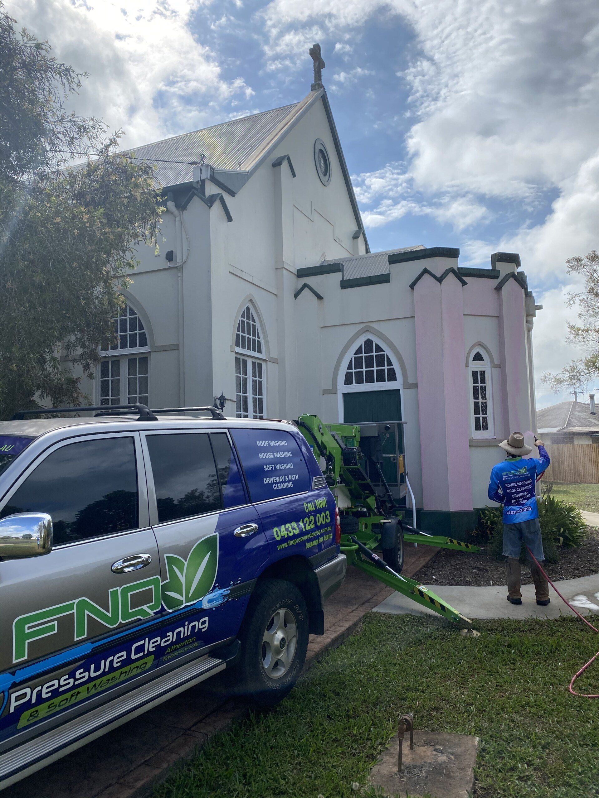 Man Cleaning The Front Of The Church — FNQ Pressure Cleaning in Atherton, QLD