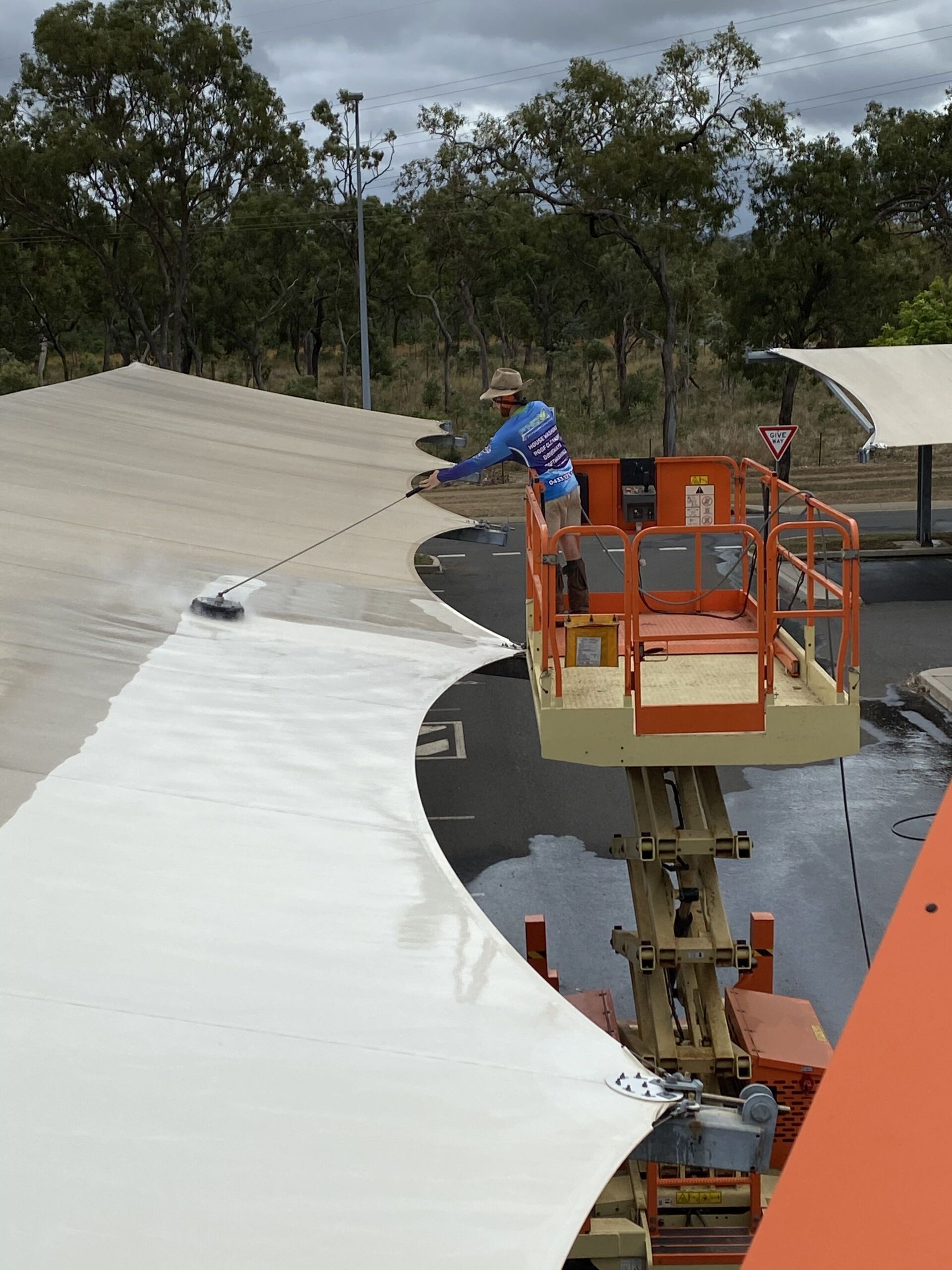 Close Up View Of Man Cleaning The Tent — FNQ Pressure Cleaning in Atherton, QLD