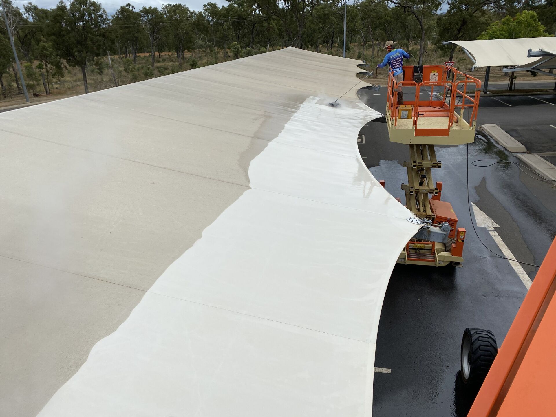 Man Cleaning The Tent — FNQ Pressure Cleaning in Atherton, QLD