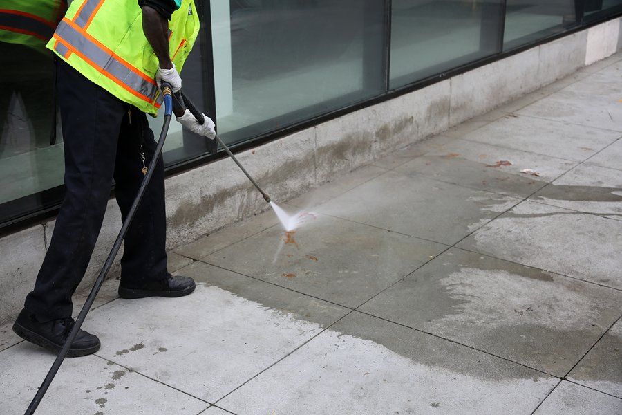 man holding a pressure washer