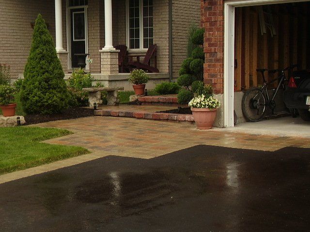 A bicycle is parked in the garage of a house.