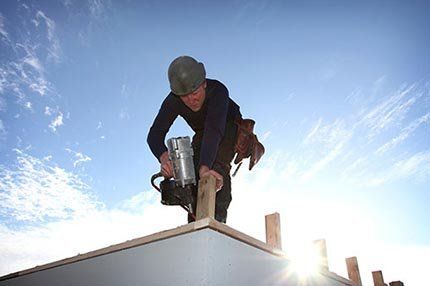 Worker on the roof - Roofing Contractors in Baytown, TX Worker on the roof - Roofing Contractors in Baytown, TX