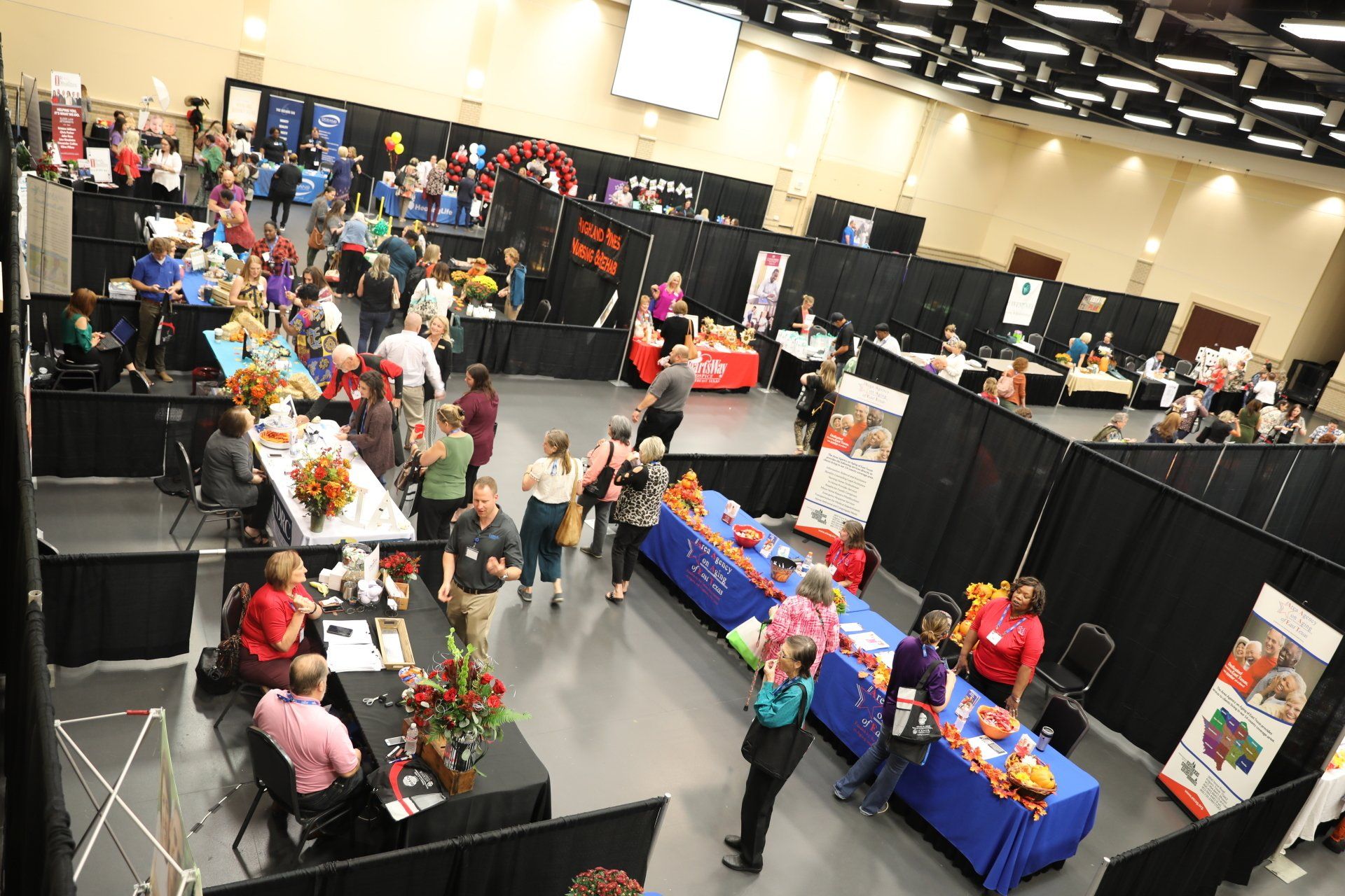crowd of people networking at conference