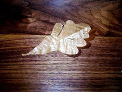 White Oak Leaf with Black Walnut Shadow Installed - Handmade Custom Inlays and Borders in Hampton, NH White Oak Leaf with Black Walnut Shadow Installed - Handmade Custom Inlays and Borders in Hampton, NH