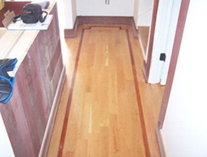 Hall way with maple field and simple Santos mahogany accent border - Handmade Custom Inlays and Borders in Hampton, NH Hall way with maple field and simple Santos mahogany accent border - Handmade Custom Inlays and Borders in Hampton, NH