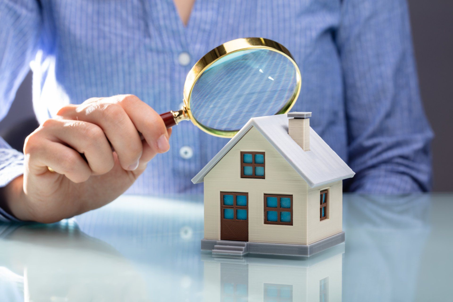 Whole Home Inspection ─ Magnifying Glass Over House Model in Sag Harbor, NY