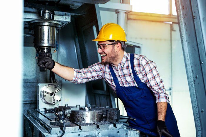 Worker Holding Machine — Brunswick, OH — Quad Fluid Dynamics, Inc.