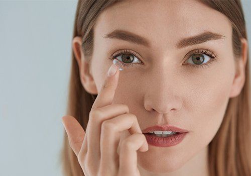 Woman Applying Eye Contacts — Danvers, MA — North Shore Eye Specialists