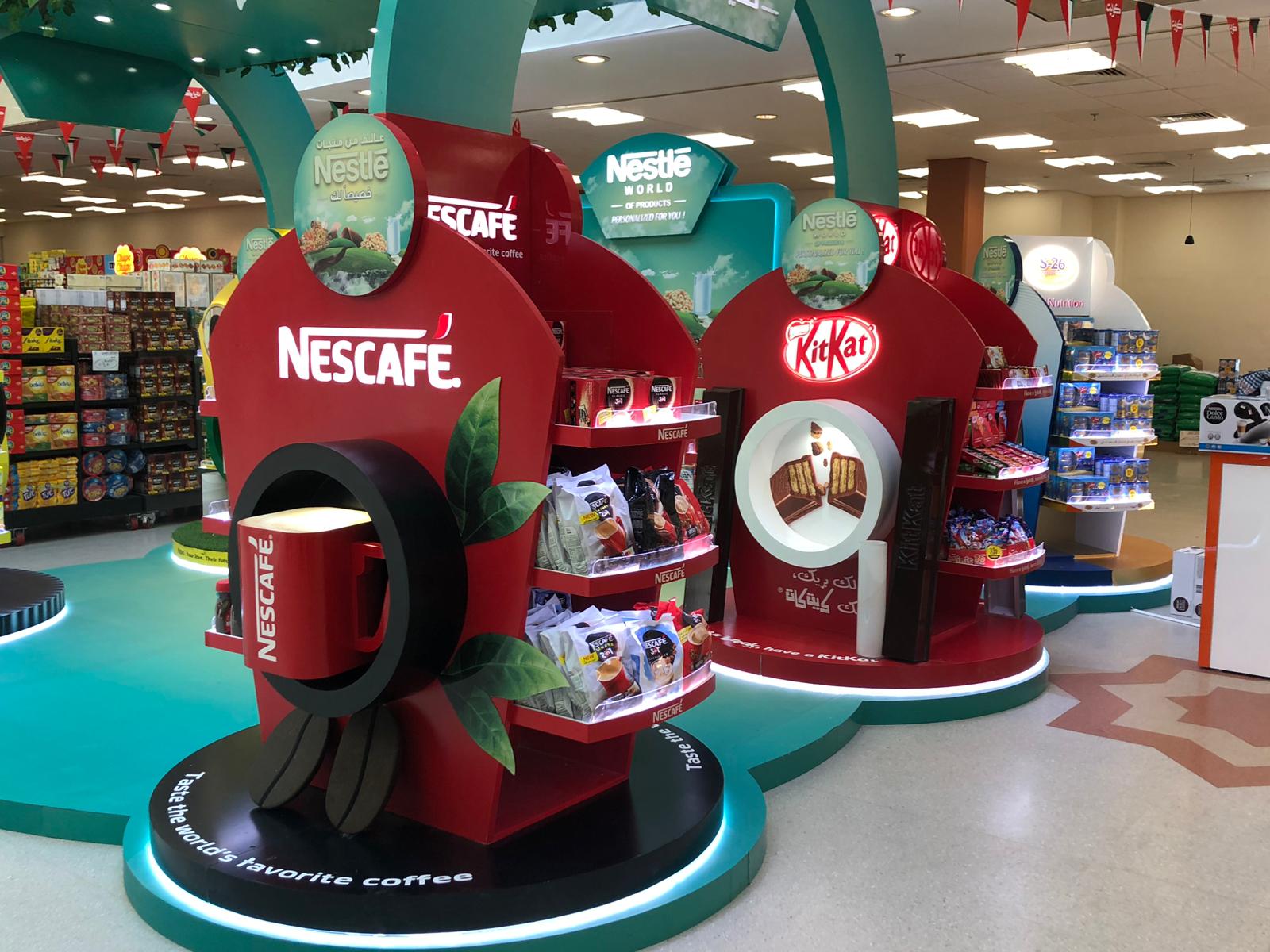 Nestlé Nescafe and Kit Kat product display in a store. Red and turquoise. Coffee cup.