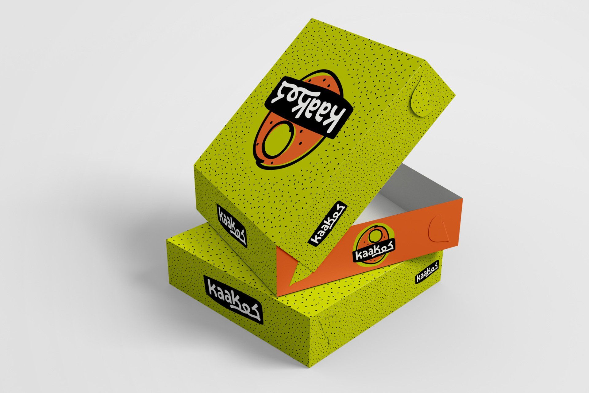 Three stacked food boxes with a yellow and orange design and the name 