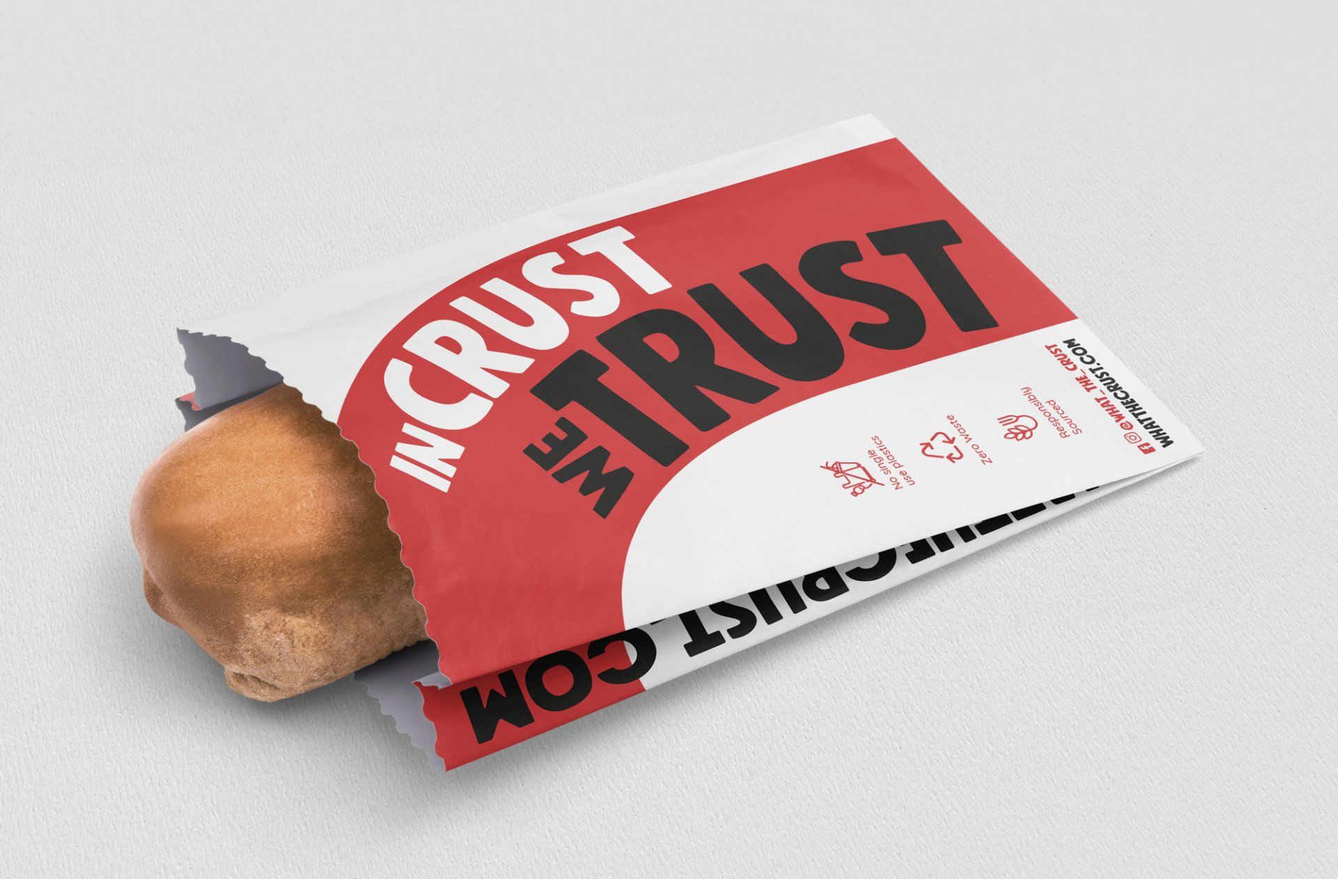 Bread roll in a white bag with red panel and the words 