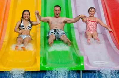 Kids going down a water slide
