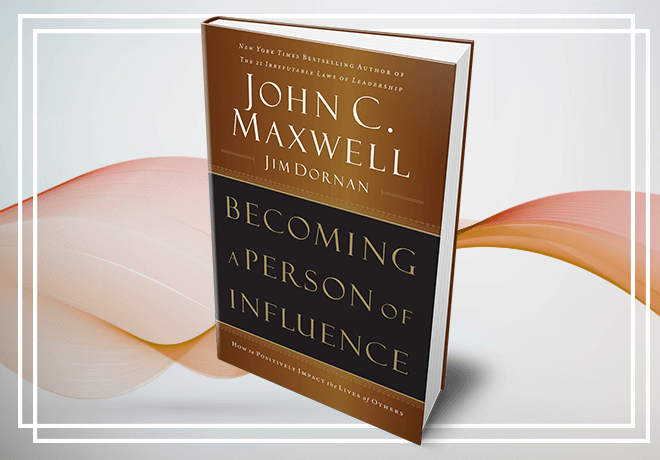 A book titled becoming a person of influence by john c. maxwell
