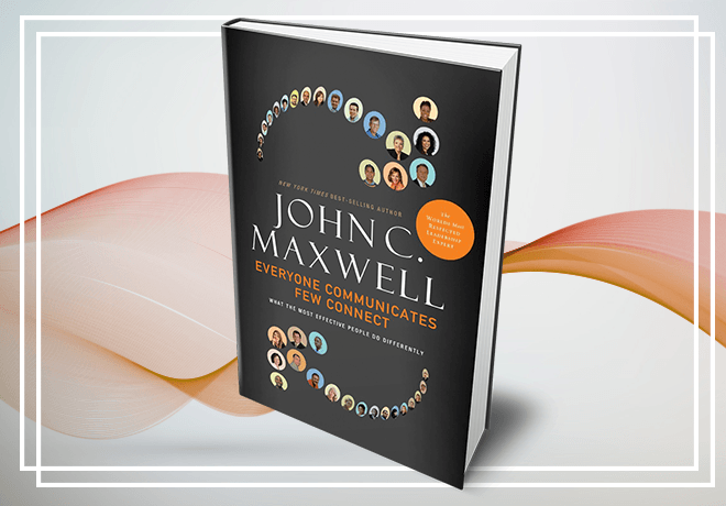 A book by john maxwell is sitting on a table