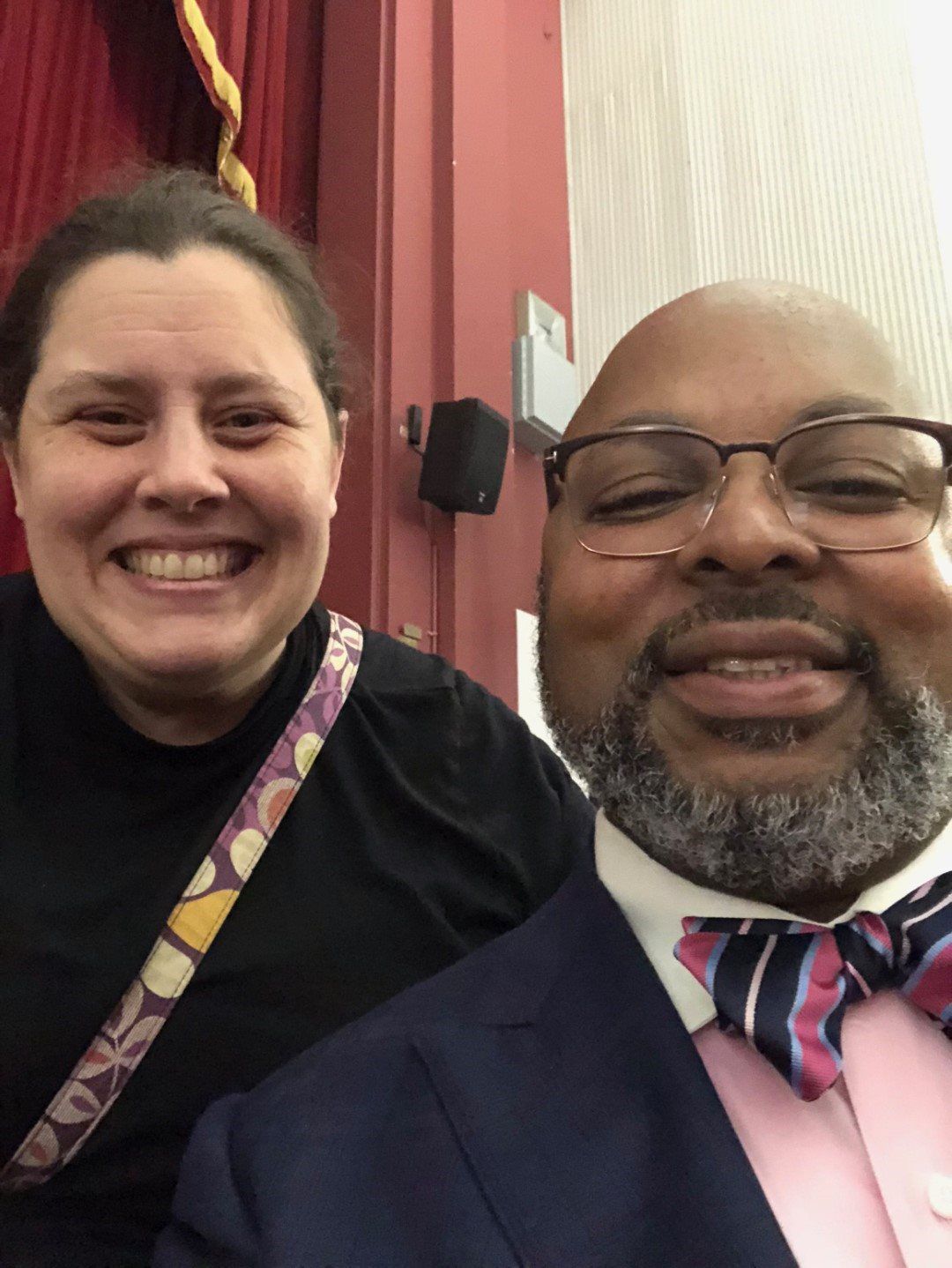 A man and a woman are posing for a picture together