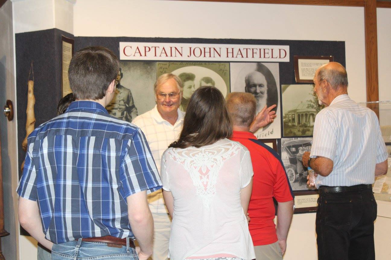 People looking at a display about 