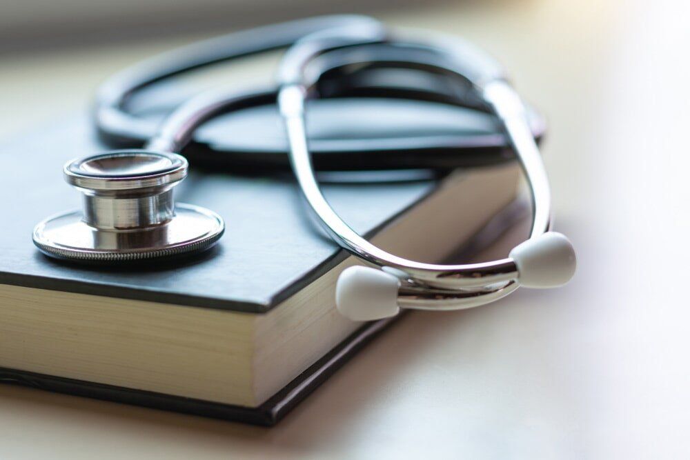 Stethoscope on top of book — Accredited Training in Rockhampton QLD Stethoscope on top of book — Accredited Training in Rockhampton QLD